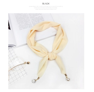 Detail of cream chiffon scarf featuring elegant faux pearl and crystal bead accents