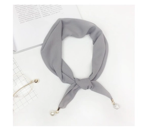 Detail of grey chiffon scarf with elegant pearl and rhinestone sphere pendant charms