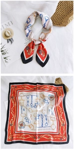 Detailed view of square silk scarf with vintage equestrian chain and belt patterns