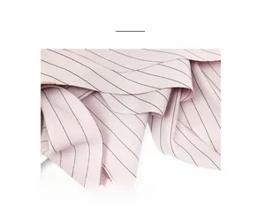 Macro shot of light pink silk scarf fabric with black stripes and clean edge detailing