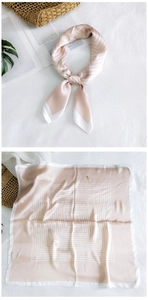 Detail of champagne pink geometric silk square scarf showing both knotted and flat views