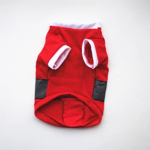 Detail of red Christmas pet vest with white ribbed trim and black decorative belt detail
