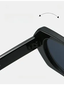 Detailed macro view of reinforced metal hinges on black glossy polygon sunglasses frames