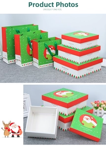 Detailed view of Christmas gift boxes and bags with Santa Claus and snowflake patterns
