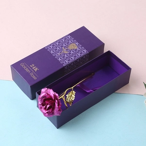 Detail of 24K gold foil rose in purple with a matching gift box and golden leaves