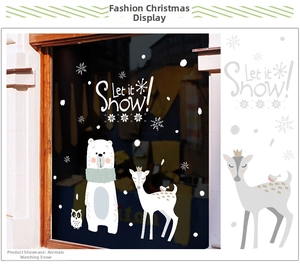 Detail of Christmas window clings featuring white polar bear, deer and owl stickers