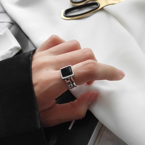 Close-up of a square black resin inlay on an S925 sterling silver chain link ring