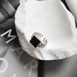 Detail shot of vintage S925 silver square black onyx ring with link chain texture