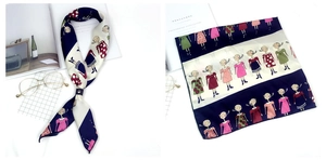Détail d'un foulard en soie avec motifs de filles de dessin animé et imprimés abstraits