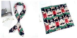 Détail d'un foulard en satin avec imprimé Casse-noisette et couleurs vibrantes