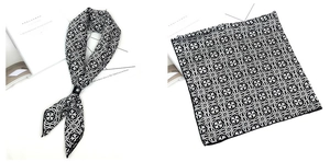 Détail d'un foulard carré en satin avec motifs géométriques noirs et blancs