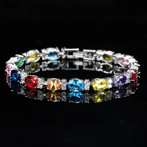Elegant silver bracelet with multi-colored oval gemstones and white zircon accents