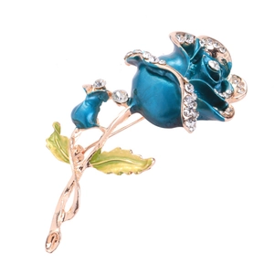Elegant rose brooch with blue enamel petals, white rhinestones, and green leaves in gold finish