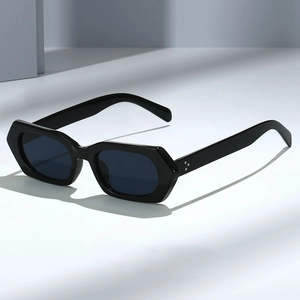 Minimalist black hexagonal sunglasses with chunky frames and silver rivet accents