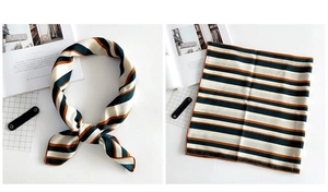 Detail of silk-like striped square scarf in navy, beige and orange with fine hemmed edges