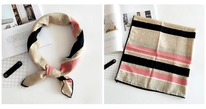 Detail of linen scarf showing pink and black stripe texture with white polka dot pattern