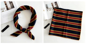 Detailed close-up showing the elegant stripe texture and knotting style of the square scarf
