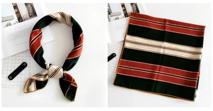 Detail of diagonal stripe linen scarf showing silk-like texture and yellow hem finishing