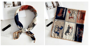 Detailed macro view of equestrian pattern silk scarf with hand-rolled edges and print detail