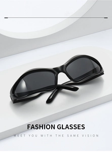 Detail shot of black Y2K sports sunglasses on a white geometric stage with fashion text