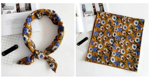 Detail of vintage floral linen square scarf in ginger yellow with blue flower prints