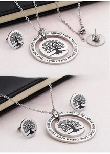 Detail of Tree of Life jewelry set featuring Hope Trust Love Dream engraved messages