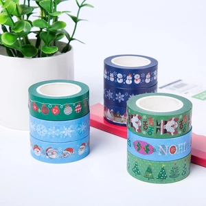 Christmas themed washi tape set featuring Santa and snowflakes on a white background