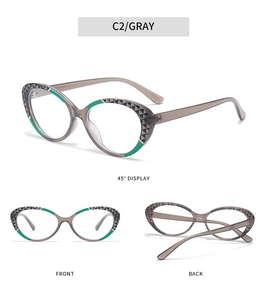 Detail view of gray cat-eye TR90 frames with green patterns and geometric side accents