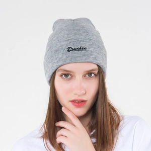 Grey Dreken knit beanie for men and women with black embroidered cursive lettering