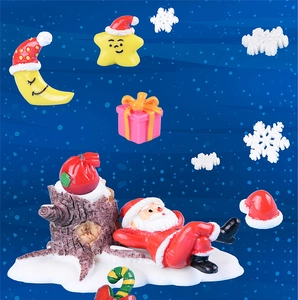 Miniature resin Christmas scene with Santa Claus and winter holiday ornaments