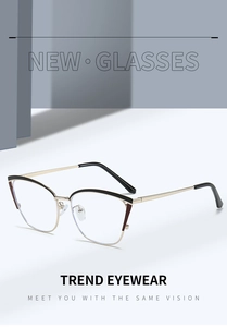 Detail view of cat-eye metal glasses frames with hollow black enamel finish and gold accents