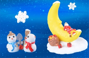 Detailed Christmas miniature set with snowmen and Santa on moon for festive decor