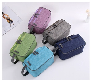 Top view of five colorful portable waterproof toiletry bags arranged in a fan shape