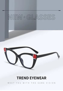 Detail of black cat-eye TR glasses frames with chic red and white color-block accents