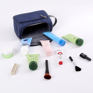 Waterproof navy blue toiletry bag with zipper pockets and handle for travel organization