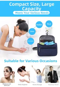 Navy blue hanging toiletry bag with multiple compartments and a metal hook for travel