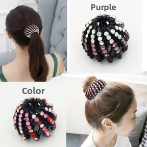 Detail of bird nest hair ring featuring colorful rhinestones on a retractable design