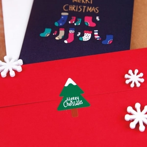 Christmas greeting card set with red envelope and green tree sticker decorations