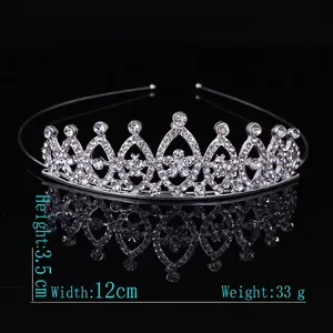 Detail of silver alloy princess crown with sparkling rhinestones on black background