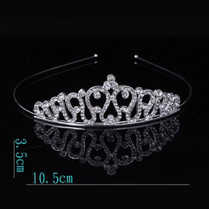 Detailed view of silver alloy princess crown with rhinestones, 3.5cm high and 10.5cm wide