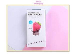 Set of 12 black ant-shaped party picks in creative packaging for appetizers and fruit