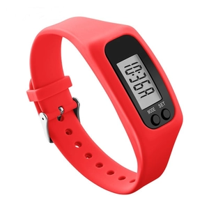 Detail of red silicone fitness tracker band with LCD screen and silver buckle closure