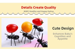 Detail view of four black ant-shaped fruit picks for party snacks and desserts