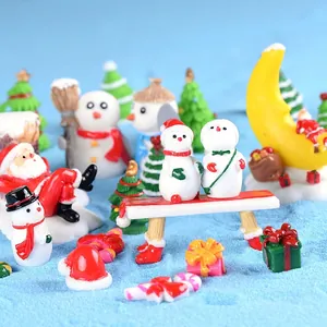 Nordic Christmas miniature resin figurines featuring Santa and snowmen on blue sand