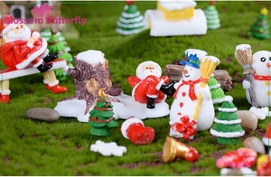 Detailed macro view of mini Christmas Santa Claus, snowmen, and festive forest landscape