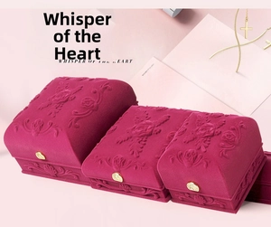 Rose red velvet jewelry box set with embossed floral patterns and golden heart clasps
