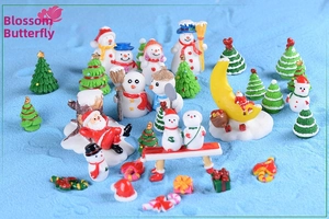 Detailed collection of festive miniature Christmas resin ornaments including snowmen and Santa