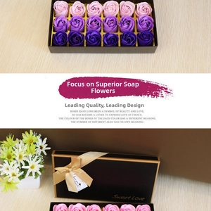 Macro shot of 18 purple gradient soap rose flowers in a luxury black gift box