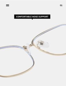 Detail of golden metal frame eyeglasses showing comfortable silicone nose pads and bridge