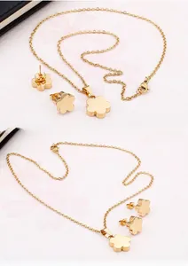 Golden flower pendant necklace and earrings set made of durable stainless steel